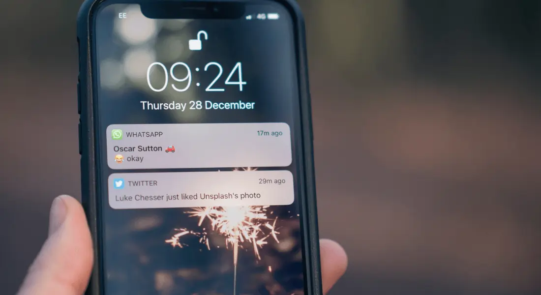 iPhone showing notifications from WhatsApp and Twitter